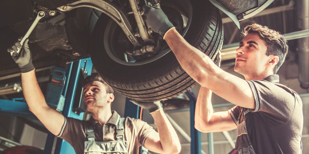 Mechanics under a vehicle - Vehicle Repairs Abingdon